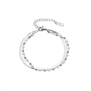 Detail of silver stainless steel double layer bracelet with flat snake chain and pearls