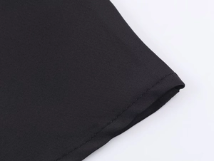 Detailed close-up showing the fine texture and uniform stitching of the black satin fabric