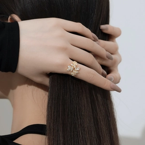 Detail of leaf-shaped S925 sterling silver ring with sparkling marquise zircon stones