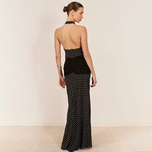 Elegant backless halter polka dot dress for women featuring a long flowing silhouette