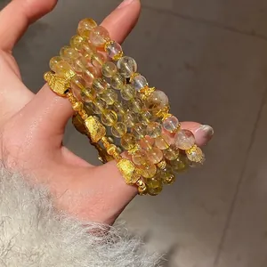 Multi-strand yellow citrine crystal bracelet with golden pixiu and zircon flower charms