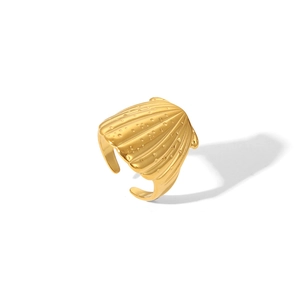 Detailed close-up of golden shell-shaped open ring with textured water droplet design
