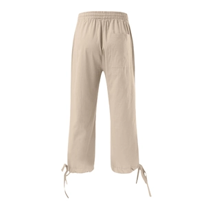Detail view of cotton linen pants featuring drawstring hem and elastic waist back