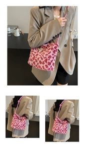 Detailed views of the pink leopard faux fur shoulder bag with a cute cartoon patch