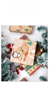 Detail view of brown Kraft Christmas wrapping paper with festive reindeer and tree patterns