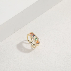 Detail of 14K gold plated ring featuring rainbow baguette stones and pave zircons
