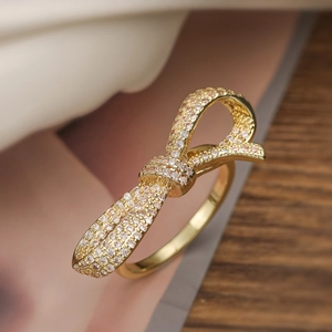 Luxurious 18K gold plated bow ring with sparkling cubic zirconia in a refined style