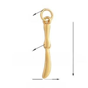 Macro detail of a 24mm gold knife pendant with precise size and weight measurements