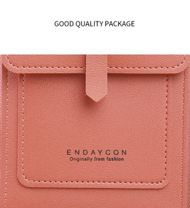 Detail of coral pink lychee leather phone bag showing stitching and metal buckle