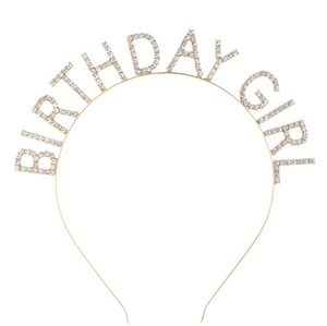Close-up of golden crown headband with sparkling BIRTHDAY GIRL rhinestone lettering