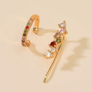 Detail of gold-plated alloy ear cuffs featuring colorful zircons and flower leaf motifs