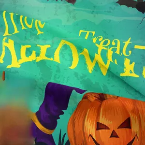 Close-up of Halloween tapestry fabric showing fine texture and vibrant pumpkin print