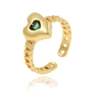 Detail of gold heart ring featuring a green gemstone center and open chain texture band