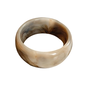 Minimalist wide resin bangle featuring marble texture in coffee and cream swirls