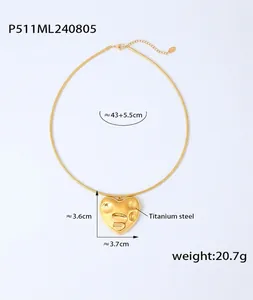 Detail showing irregular molten texture on golden heart pendant with dimensions and weight
