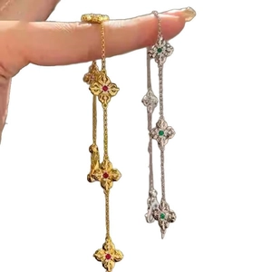 14k gold plated lucky clover bracelet with red and green cubic zirconia stones