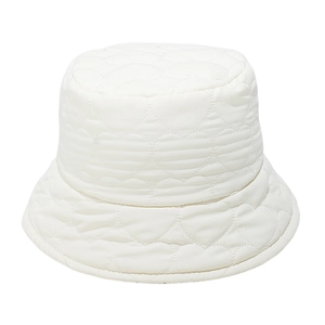 Detail of white quilted bucket hat featuring heart pattern stitching and soft texture