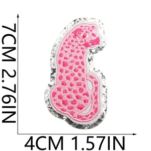 Pink leopard embroidered patch with silver sequins, dimensions 7cm x 4cm on white background