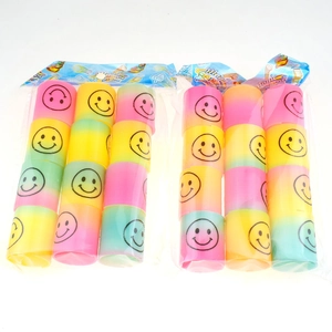 Set of colorful mini rainbow spring toys with smiley face prints on white background