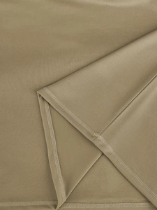 Detailed close-up of khaki breathable bird-eye mesh fabric with precise stitching