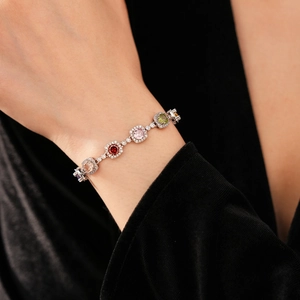 Close-up of vintage multi-color gemstone bracelet with cubic zirconia on model wrist