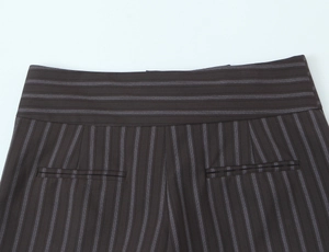 Detail of dark brown pinstripe trousers showing waistband and rear welt pockets