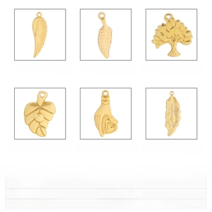 Detailed set of gold and steel pendants featuring wing, leaf, and tree of life motifs