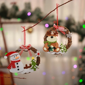 Detailed view of handmade Christmas rattan wreaths with cute snowman and reindeer decorations.