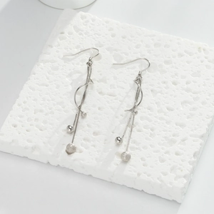 925 Sterling Silver long tassel drop earrings with beads on a textured stone block
