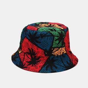 Detailed top view of a colorful reversible bucket hat with tropical palm tree patterns