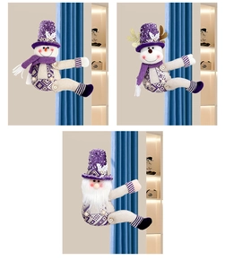 Detail of purple sequined snowman and gnome curtain tiebacks on blue fabric