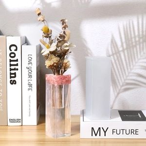 Detail of square pillar silicone mold and finished resin flower vase with dried flowers