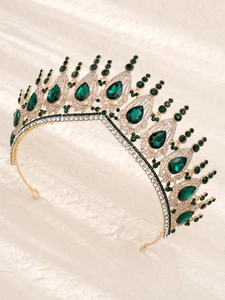 Detailed view of luxury gold bridal crown with vintage green waterdrop rhinestones