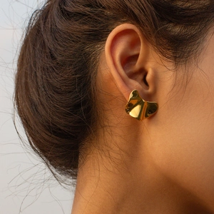 Irregular 18k gold plated stainless steel stud earrings shown on model ear