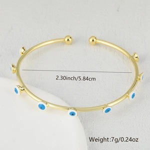 Detail showing the 5.84cm diameter and 7g weight of the gold evil eye bangle