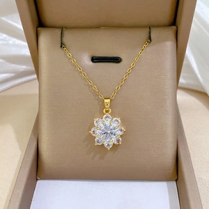 Elegant 18K gold-tone titanium necklace with a sparkling flower zircon pendant on velvet