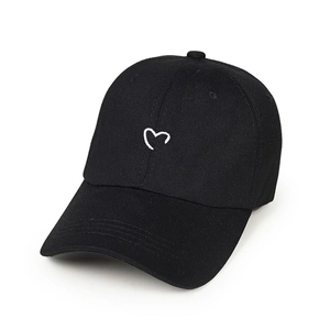 Classic black cotton baseball cap with minimalist white heart embroidery and curved brim