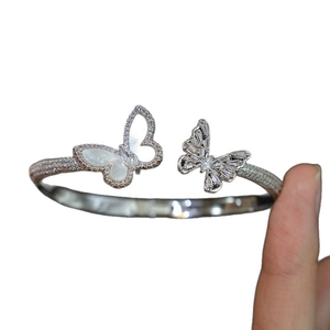 Elegant adjustable silver butterfly bracelet with shimmering zircon and white shell inlay