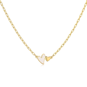 Close-up of gold paperclip chain with a white enamel heart and small gold heart pendant