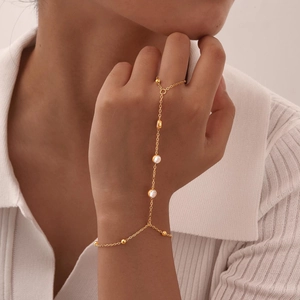 Detailed close-up of an 18K gold plated double layer hand chain featuring round zircons