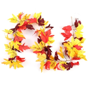 Detail of autumn maple leaf LED string light with silk leaves and a white battery box