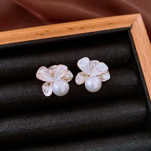 French vintage 18K gold plated flower earrings with elegant pearls on black velvet tray