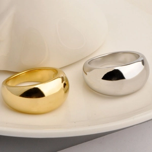 Minimalist thick dome rings in gold and silver finish with high-polish metallic surface