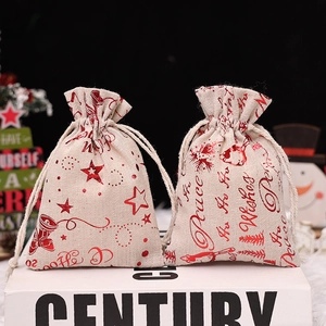 Christmas burlap gift bags with red foil reindeer and star prints and drawstrings