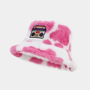 Detail of pink cow print faux fur bucket hat with vintage radio embroidery patch