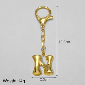 Detailed size view of golden 18k plated letter H keychain with 10cm height and 14g weight