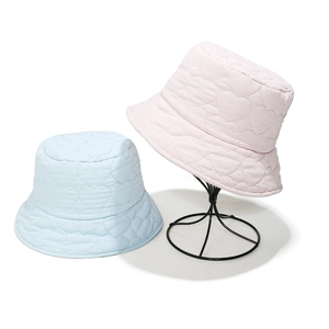 Padded heart-quilted bucket hat in light blue and pink, stylish warm winter headwear