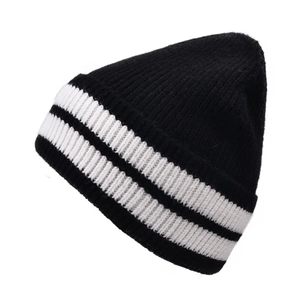Close-up of thick ribbed knit beanie featuring classic black and white stripe texture