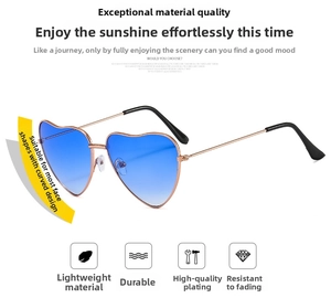 Detailed view of heart-shaped sunglasses with blue gradient lenses and gold frames