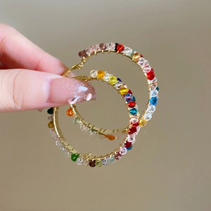 Silver needle hoop earrings with colorful round crystal beads in elegant wrap design